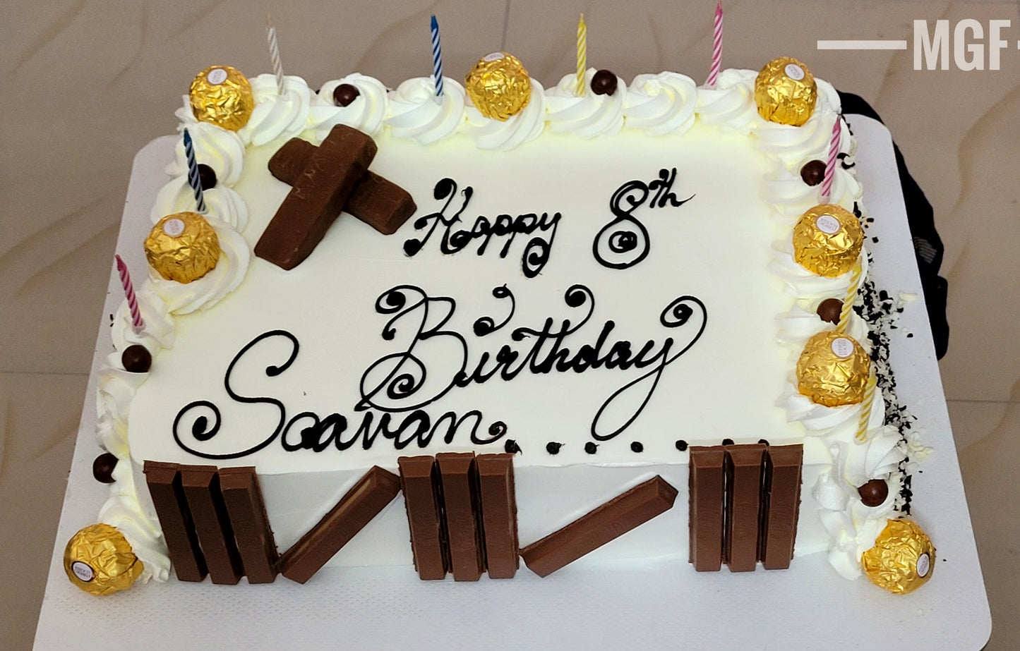 Kitkat Butterscotch Cake decorated with Ferrero Rocher