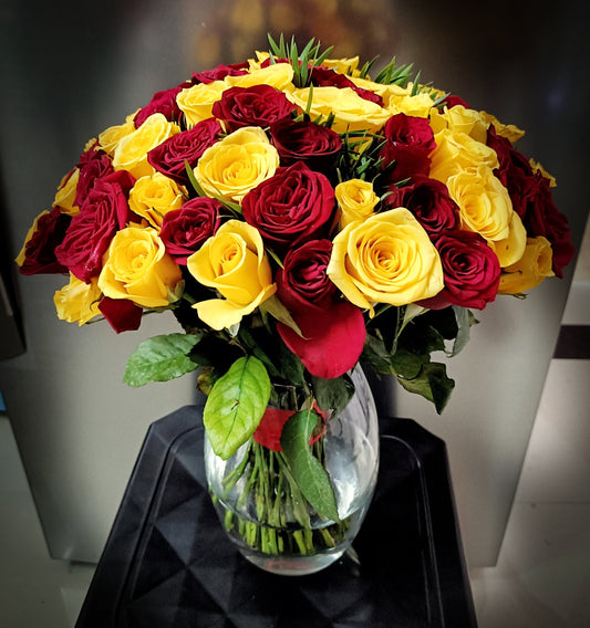 50 Red & Yellow roses in Vase