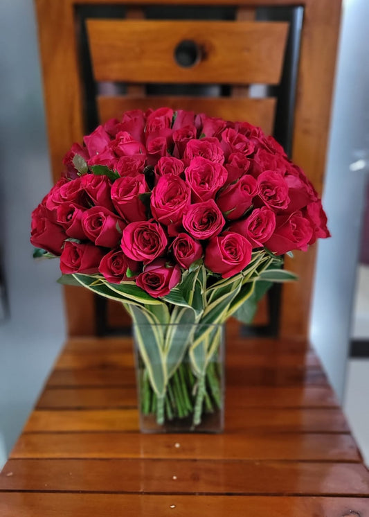 50 red roses in a Glass Vase